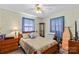 Cozy bedroom features soft carpeting, neutral walls, and large window with natural light at 157 E Meadowview Dr, Statesville, NC 28625