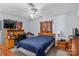Cozy bedroom featuring a ceiling fan, wooden desk, and warm, neutral tones at 157 E Meadowview Dr, Statesville, NC 28625
