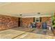 A large brick carport featuring a grill, storage, and ample space for parking and outdoor activities at 157 E Meadowview Dr, Statesville, NC 28625