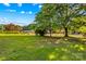 This homesite features a spacious front yard and mature trees at 157 E Meadowview Dr, Statesville, NC 28625