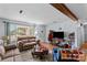 Comfortable living room offers hardwood floors, natural light, and neutral paint at 157 E Meadowview Dr, Statesville, NC 28625