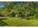 An exterior image showcases sheds and barns on a lush lot, with plenty of space for outdoor adventures at 157 E Meadowview Dr, Statesville, NC 28625