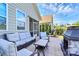 Beautiful back patio with comfortable seating, a fireplace, and access to the screened-in porch at 174 Hanks Bluff Dr, Mooresville, NC 28117