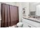 This is a bathroom with a vanity that has a granite countertop and white cabinets, with a shower and decorative shelving at 174 Hanks Bluff Dr, Mooresville, NC 28117
