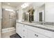 Elegant bathroom with a double vanity, granite countertop, and spacious glass-enclosed shower at 174 Hanks Bluff Dr, Mooresville, NC 28117