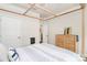 Serene bedroom with a wooden bed frame, soft lighting, and a view into the hallway at 174 Hanks Bluff Dr, Mooresville, NC 28117