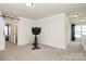 This is a bonus room with neutral carpet, a ceiling fan, and plenty of natural light at 174 Hanks Bluff Dr, Mooresville, NC 28117