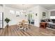 Well-lit dining area with natural light streaming, perfect for Gathering gatherings and entertaining guests at 174 Hanks Bluff Dr, Mooresville, NC 28117