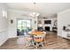 Bright dining area with natural light, chandelier, and sliding glass doors leading to an outdoor area at 174 Hanks Bluff Dr, Mooresville, NC 28117