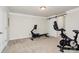 This is an exercise room with carpet and multiple workout machines at 174 Hanks Bluff Dr, Mooresville, NC 28117