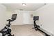 This is an exercise room with carpet and multiple workout machines at 174 Hanks Bluff Dr, Mooresville, NC 28117