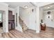 Inviting foyer with hardwood floors, staircase, and elegant decor at 174 Hanks Bluff Dr, Mooresville, NC 28117