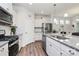Modern kitchen with stainless steel appliances, granite countertops, and ample cabinet space, perfect for cooking at 174 Hanks Bluff Dr, Mooresville, NC 28117