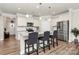 Modern kitchen featuring an island with seating, stainless steel appliances, and stylish decor for culinary enjoyment at 174 Hanks Bluff Dr, Mooresville, NC 28117
