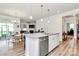 Bright kitchen island with granite countertops, stainless steel appliances, and modern lighting at 174 Hanks Bluff Dr, Mooresville, NC 28117