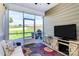 Relax in this screened porch, with a view to the backyard and patio with its comfortable seating and outdoor grill at 174 Hanks Bluff Dr, Mooresville, NC 28117