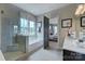 Clean, bright bathroom with a tub, shower, and modern fixtures at 18125 Sulton Terrace Dr, Huntersville, NC 28078