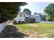 Large, fenced backyard showcasing a spacious screened-in porch, offering privacy and outdoor living at 18629 Coachmans Trce, Cornelius, NC 28031