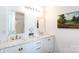 Bathroom with double sink vanity featuring marble counters and modern fixtures at 18629 Coachmans Trce, Cornelius, NC 28031
