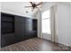 Bedroom featuring hardwood floors and built in shelves and cabinets at 18629 Coachmans Trce, Cornelius, NC 28031