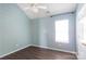 Bedroom featuring hardwood floors, patterned wallpaper, and natural light at 18629 Coachmans Trce, Cornelius, NC 28031