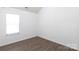 Bedroom with hardwood floors and bright natural light at 18629 Coachmans Trce, Cornelius, NC 28031