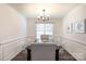 Elegant dining room with classic details, perfect for hosting gatherings and meals at 18629 Coachmans Trce, Cornelius, NC 28031
