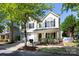 Charming two-story home with a well-manicured lawn and inviting curb appeal on a sunny day at 18629 Coachmans Trce, Cornelius, NC 28031