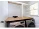 Convenient laundry room with folding counter and upper shelving at 18629 Coachmans Trce, Cornelius, NC 28031
