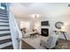 Inviting living room featuring a fireplace and comfortable seating at 18629 Coachmans Trce, Cornelius, NC 28031