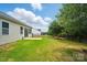 Expansive backyard featuring a patio, lush green lawn, and secure fencing, perfect for outdoor enjoyment and privacy at 1957 Tablerock Dr # 59, York, SC 29745