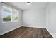 Sunlit bedroom with two windows and wood flooring, creating a comfortable and serene atmosphere at 1957 Tablerock Dr # 59, York, SC 29745
