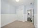 A bedroom with closet doors and board and batten accent and neutral carpeting at 1957 Tablerock Dr # 59, York, SC 29745