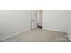 An empty bedroom with neutral carpet and fresh white paint at 1957 Tablerock Dr # 59, York, SC 29745