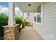 Inviting covered front porch with stone accents, offering a cozy and stylish entryway to the home at 1957 Tablerock Dr # 59, York, SC 29745