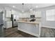 Modern kitchen with stainless steel appliances, granite countertops, and a central island, perfect for cooking at 1957 Tablerock Dr # 59, York, SC 29745
