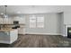 Spacious kitchen with stainless steel appliances, granite countertops, and a fireplace in the adjacent living area at 1957 Tablerock Dr # 59, York, SC 29745
