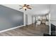 Open-concept living room featuring durable wood-look floors and leading into a kitchen with a large central island at 1957 Tablerock Dr # 59, York, SC 29745