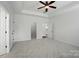 Spacious main bedroom with tray ceiling, neutral carpet, and multiple doorways at 1957 Tablerock Dr # 59, York, SC 29745