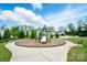 A vibrant community playground features a slide and play structure surrounded by green space at 1957 Tablerock Dr # 59, York, SC 29745