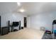 Versatile basement area suitable for entertainment or exercise, carpeted and freshly painted at 201 Vanderbilt Blvd, Locust, NC 28097