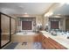This bathroom includes a soaking tub, dual vanities, tiled floors, and a separate shower area at 201 Vanderbilt Blvd, Locust, NC 28097