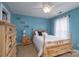 Bright bedroom with a ceiling fan, a wooden bed frame and a nice dresser at 201 Vanderbilt Blvd, Locust, NC 28097