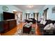 Inviting living room features hardwood floors, a cozy seating area, and ample natural light from large windows at 201 Vanderbilt Blvd, Locust, NC 28097