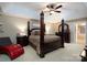 This large main bedroom boasts a four-post bed, ample closet space, and a ceiling fan at 201 Vanderbilt Blvd, Locust, NC 28097