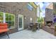 Outdoor patio area with fireplace, seating, and brick exterior, perfect for relaxing at 201 Vanderbilt Blvd, Locust, NC 28097