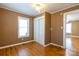 Cozy bedroom featuring laminate flooring, natural light, and paneled walls at 205 Stowe Acres Rd, Kings Mountain, NC 28086