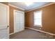 Cozy bedroom featuring a closet, a window, and neutral carpet at 205 Stowe Acres Rd, Kings Mountain, NC 28086