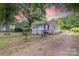 Exterior side view of fenced yard and traditional-style single-story home at 205 Stowe Acres Rd, Kings Mountain, NC 28086