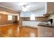 Open-concept kitchen featuring ample cabinet space and laminate flooring at 205 Stowe Acres Rd, Kings Mountain, NC 28086